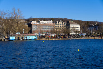 Cityscape of Zürich with lake Zürich in the foreground on a sunny winter day. Photo taken February 5th, 2022, Zurich, Switzerland.