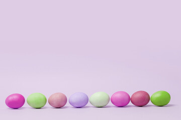 Happy Easter card with abstract minimal scene with easter eggs in cream colors.