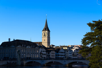 Church tower of medieval protestant church St. Peter at the old town of Zürich on a sunny winter day. Photo taken February 5th, 2022, Zurich, Switzerland.