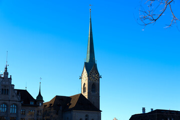 Fototapeta na wymiar Church tower of medieval protestant church Women's Minster at the old town of Zürich on a sunny winter day. Photo taken February 5th, 2022, Zurich, Switzerland.