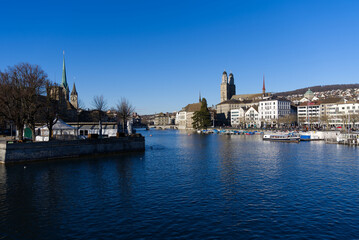 Skyline of the old town of Zürich on a sunny winter afternoon with river Limmat in the foreground. Photo taken February 5th, 2022, Zurich, Switzerland.