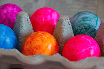 Colorful Easter eggs in cardboard packaging, preparation for the holiday.