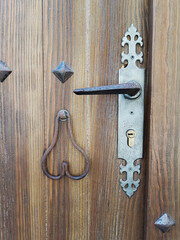 Handles of an old solid wood door