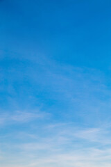 Vertical image white clouds in blue sky in the morning.