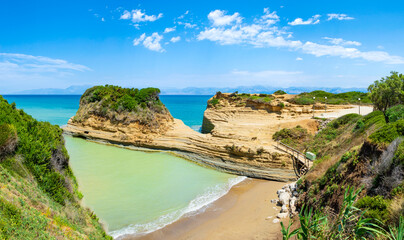 Canal D'Amour or Channel of Love in Sidari, Corfu island in Greece. Famous romantic beach with clay rocky cliffs and rugged coast. Popular destination for summer vacation