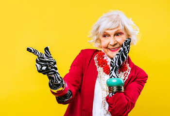 Cool and stylish senior old woman with fashionable clothes