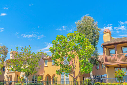 Fenced mediterranean style houses with fence at Ladera Ranch in Southern California