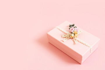 Beautiful pink gift box isolated on pastel background. Gift for holiday, birthday, Wedding, Mother's Day, Valentine's day, Women's Day. Copy space. Top view, flat lay.