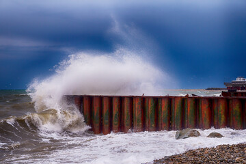 Sea wave stone crash at breakwater