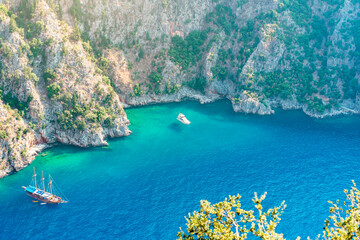 Beautiful view of Butterfly Valley. Butterfly Valley (Turkish: Kelebekler Vadisi) is a valley in Fethiye district of Mugla Province, southwestern Turkey, which is home to diverse butterfly species.