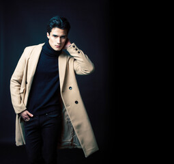 handsome asian fashion looking man posing in studio on black background, lifestyle modern people concept