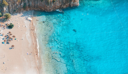 Spectacular view of the clear beach and transparent turquoise sea of Butterfly Valley. Butterfly Valley (Turkish: Kelebekler Vadisi) is a valley in Fethiye district of Mugla Province, Turkey.
