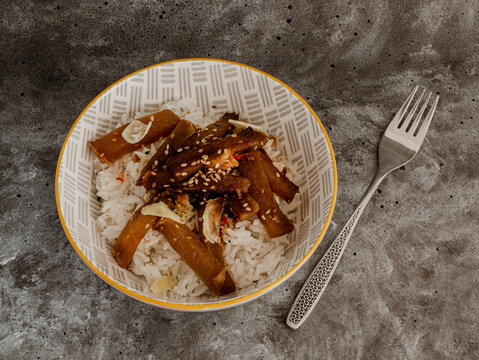 Vegetarian Teriyaki and rice bowl on rustic grey Background