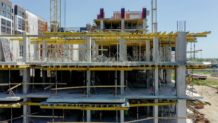 Aerial view of high residential apartment building under construction. Real estate development