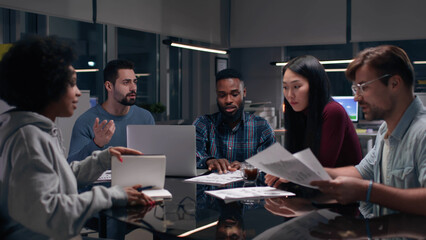 Multiethnic team having board meeting in office. 