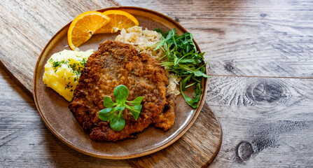 Pork breaded cutlet coated with breadcrumbs with mashed potatoes - obrazy, fototapety, plakaty