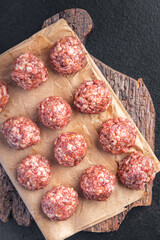 meatballs raw meat beef pork chicken fresh portion dietary healthy meal food diet still life snack on the table copy space food background rustic top view keto or paleo diet