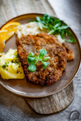 Pork breaded cutlet coated with breadcrumbs with mashed potatoes