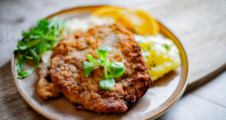 Pork breaded cutlet coated with breadcrumbs with mashed potatoes