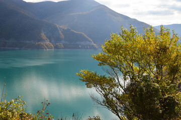 Lake ​​shore with sandy beach in autumn in Georgia, Europe