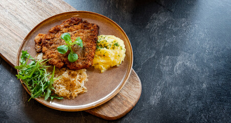 Pork breaded cutlet coated with breadcrumbs with mashed potatoes