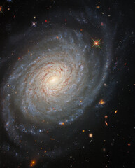 ESA/Hubble: Galactic Tranquility. The lazily winding spiral arms of the spectacular galaxy NGC 976.