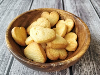 homemade cookies hearts on a wooden background in a plate.  valentines day holiday concept