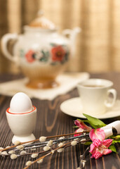 Home interior with Easter decor. A mockup with willow branches and an egg.