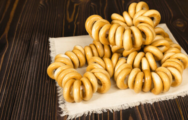 A lot of bagels lying on a linen napkin. Traditional Russian pastries. Selective focus.