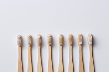 Set of ECO friendly wooden bamboo toothbrushes. Save the planet or NO plastic concept. Isolated on white background.