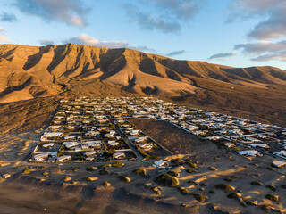 Famara village and Risco de Famara mountains in the background, Spain