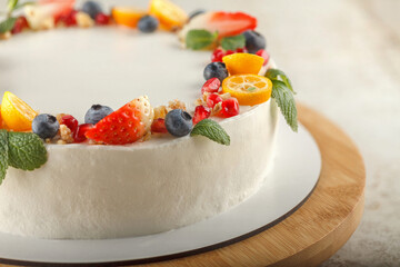 Carrot-orange cake for diabetics decorated with fresh fruit and mint