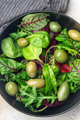 olives green salad fresh portion dietary healthy meal food diet still life snack on the table copy space food background rustic top view keto or paleo diet veggie vegan or vegetarian food