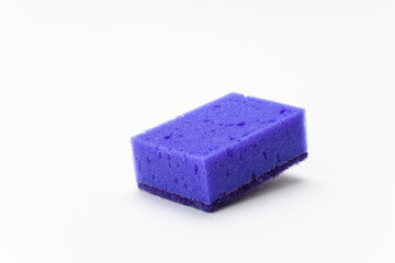 Purple sponge for washing dishes on a white background.