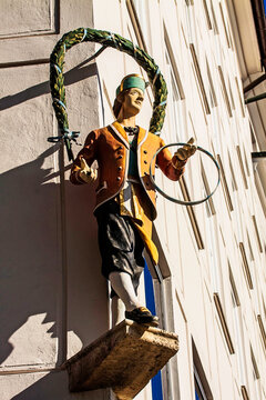 Munich, Cooper's corner, traditional cooper figure with the ancient costume of the barrel maker confraternity in city center