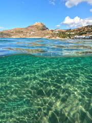 Underwater split photo taken from beautiful emerald bay and beach of Kapsali overlooking famous castle of Kythira island, Ionian, Greece
