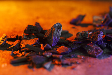 Charcoal on an orange background