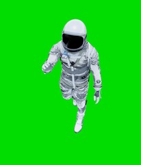 Astronaut isolated on green background.