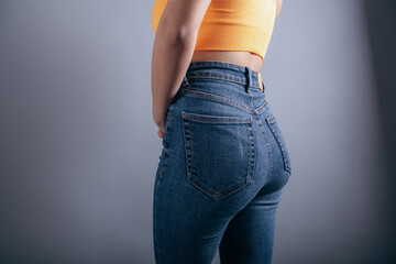 young woman posing in jeans