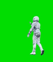 Astronaut isolated on green background.