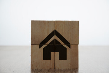 Obraz na płótnie Canvas Home icons or symbol on a wooden cubes over the white background. property and insurance banner