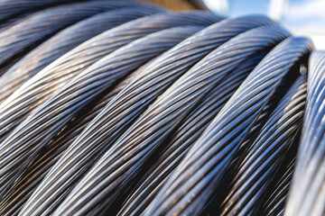 Background of wooden coils of electric cable outdoor.