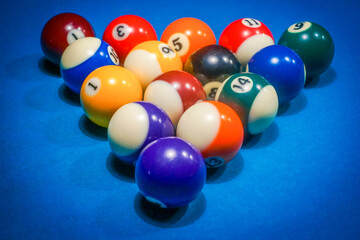 Pool game - balls in triangular shape on a table