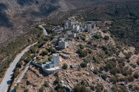 Clusters of abandoned houses, towers and chapels on the hills, Vatheia (or Vathia), Greece