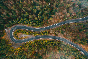 Serpentine roads in Ukraine, fog in the mountains, serpentine road in the fog, drove on top of the road.