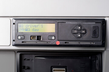 Close up of tachograph with 15 minutes of driving left warning on display. Driver is due to take 45 minutes break.