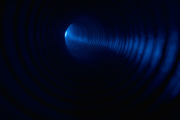 Fluorescent background. Blur neon light. Spotlight illumination. Defocused led blue color glow ray in ribbed texture swirl tunnel on dark black copy space.