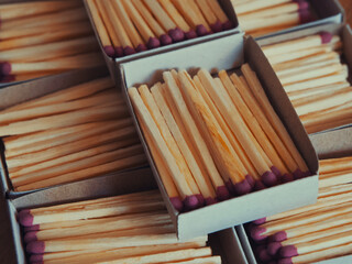 Obraz premium Several boxes filled with matches, a close-up shot. Matchboxes.