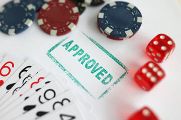 Casino playing cards chips and seal approved closeup