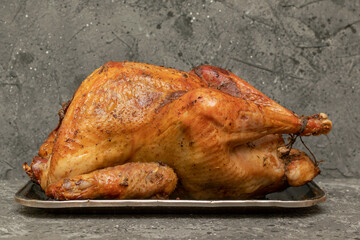Roasted turkey with oranges, rosemary and cranberries on the Christmas table. Top view with copy space.